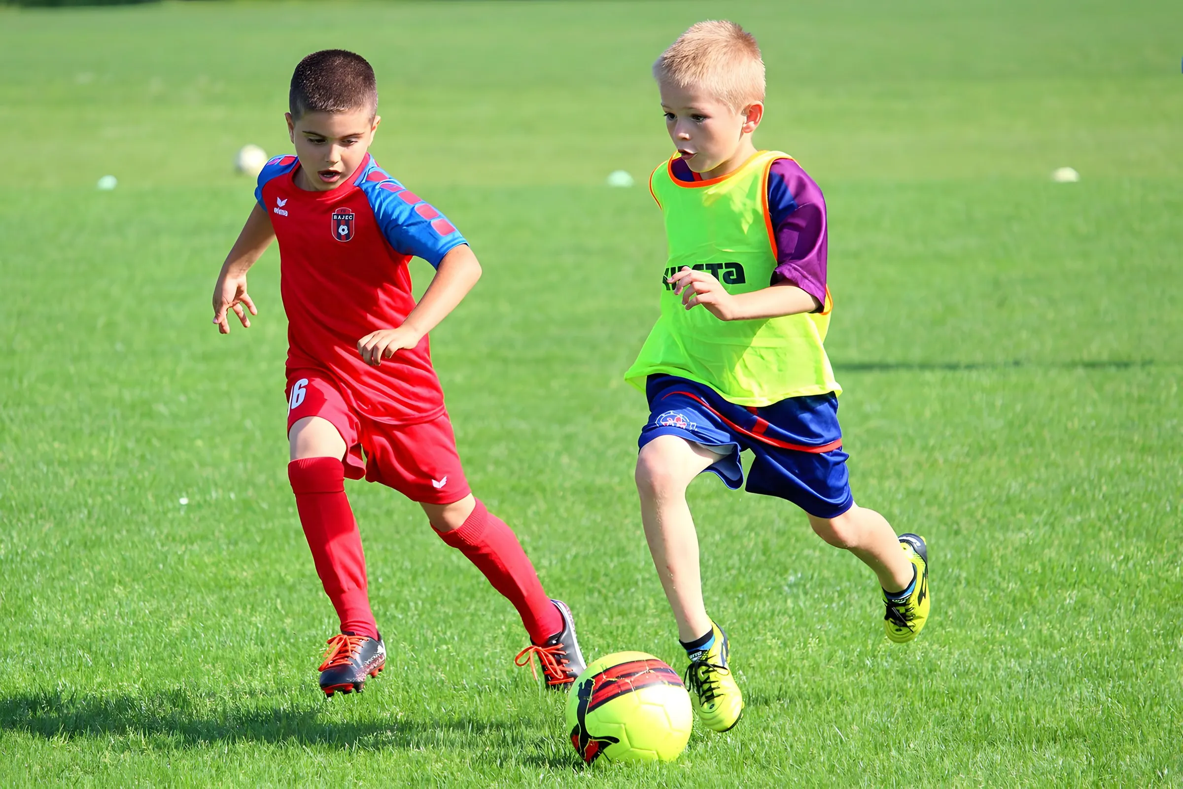 Young footballers chasing the ball