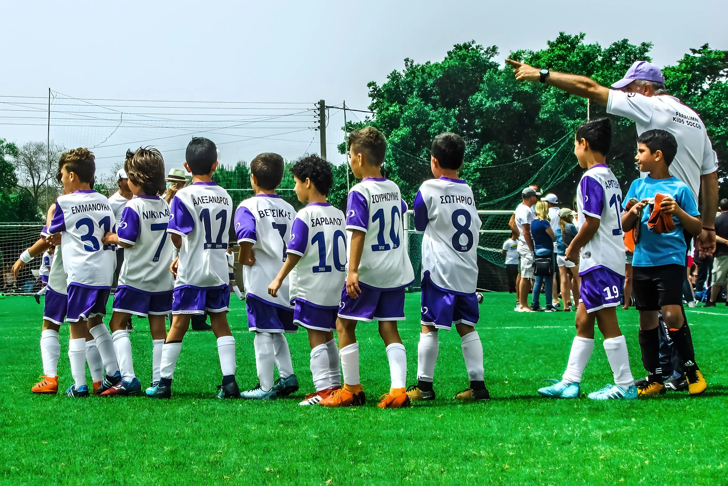 A youth football team lined up before a match